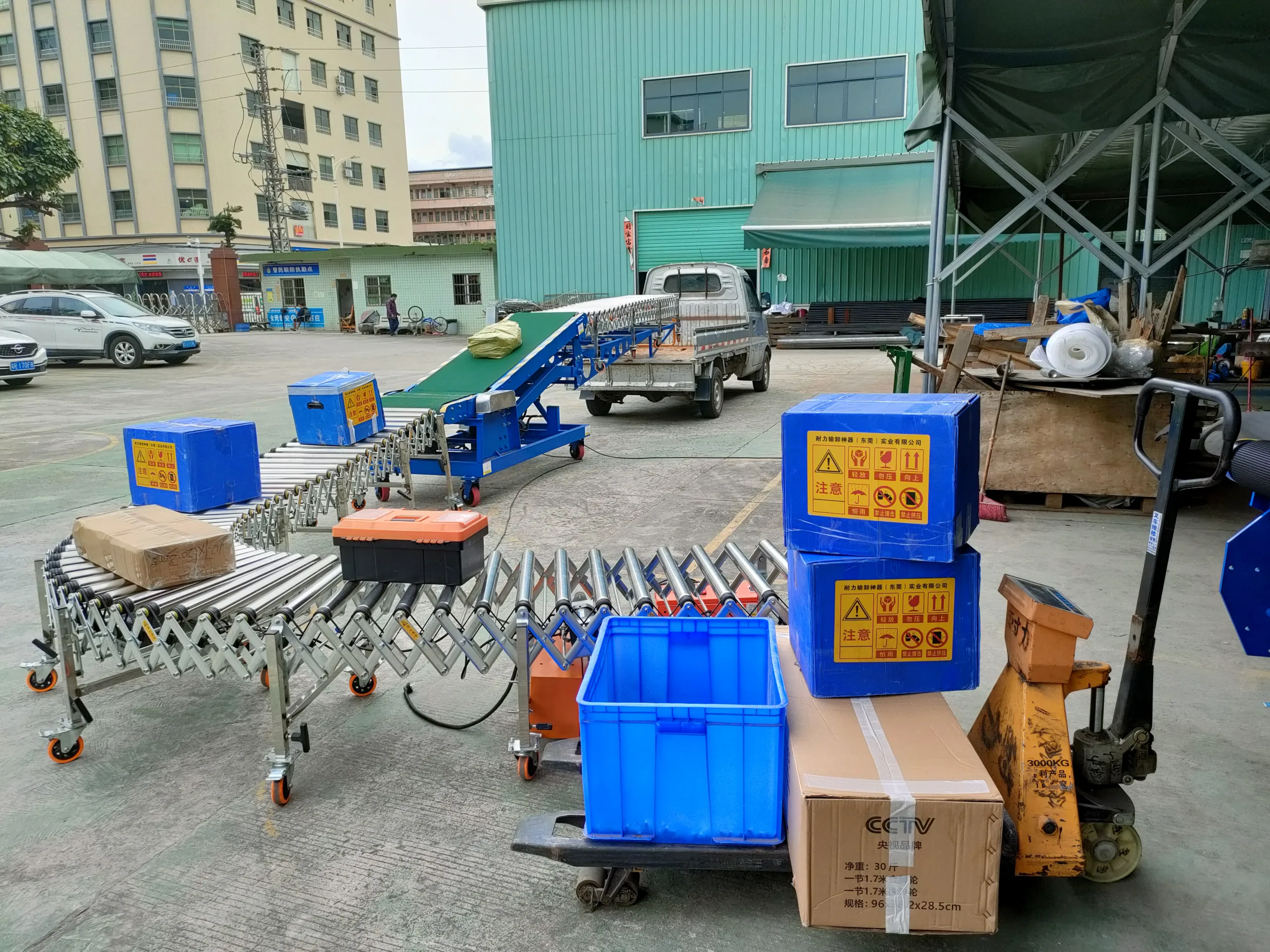 flexible powered roller conveyor loading goods onto a small truck