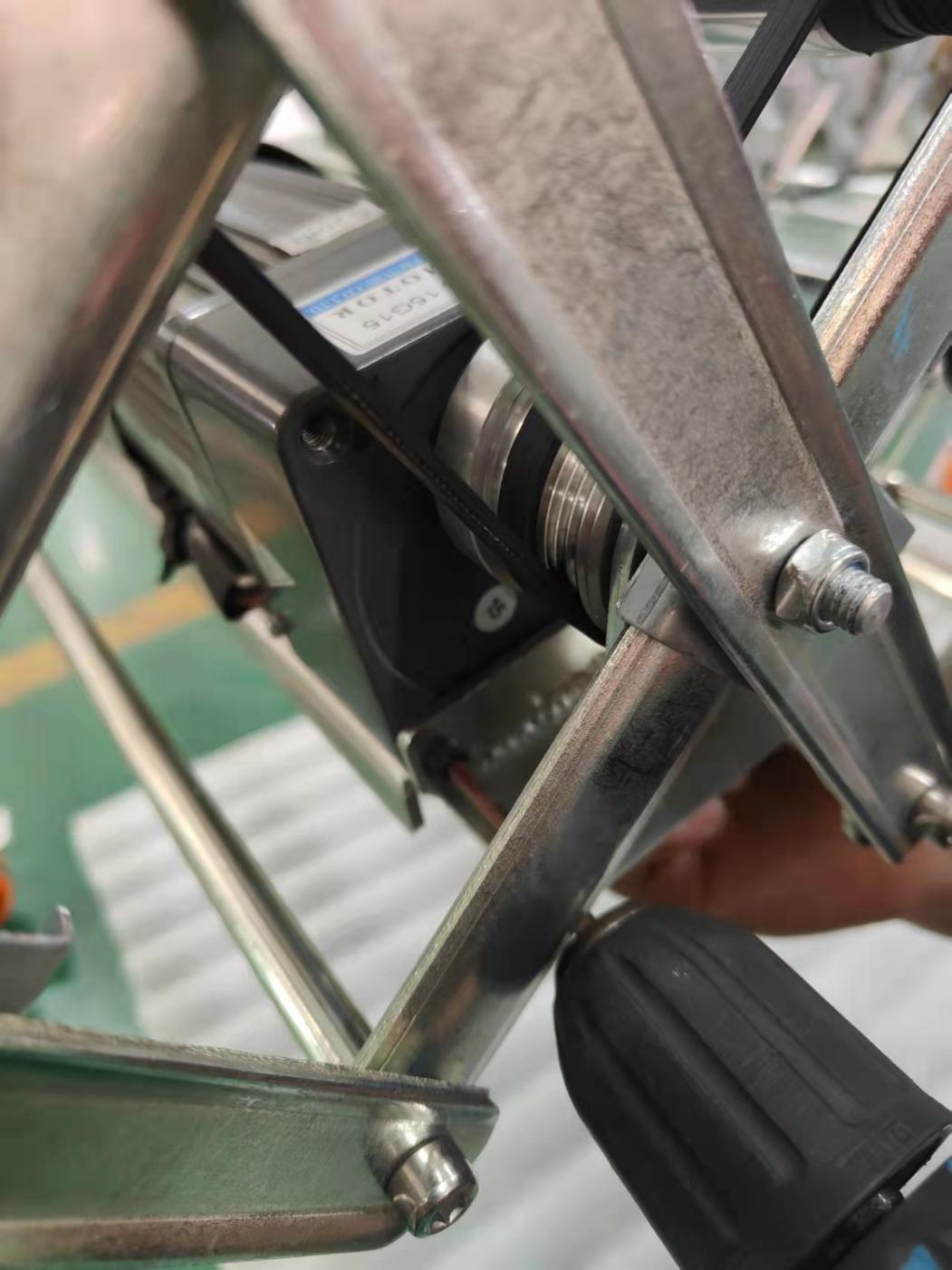 2. Loosen half of motor screws