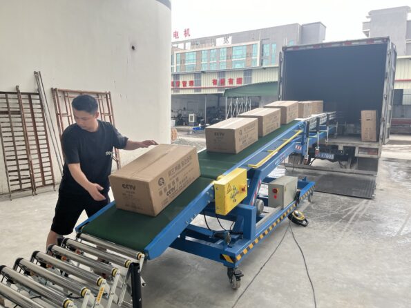 Large Hydraulic Conveyor loading goods onto a truck