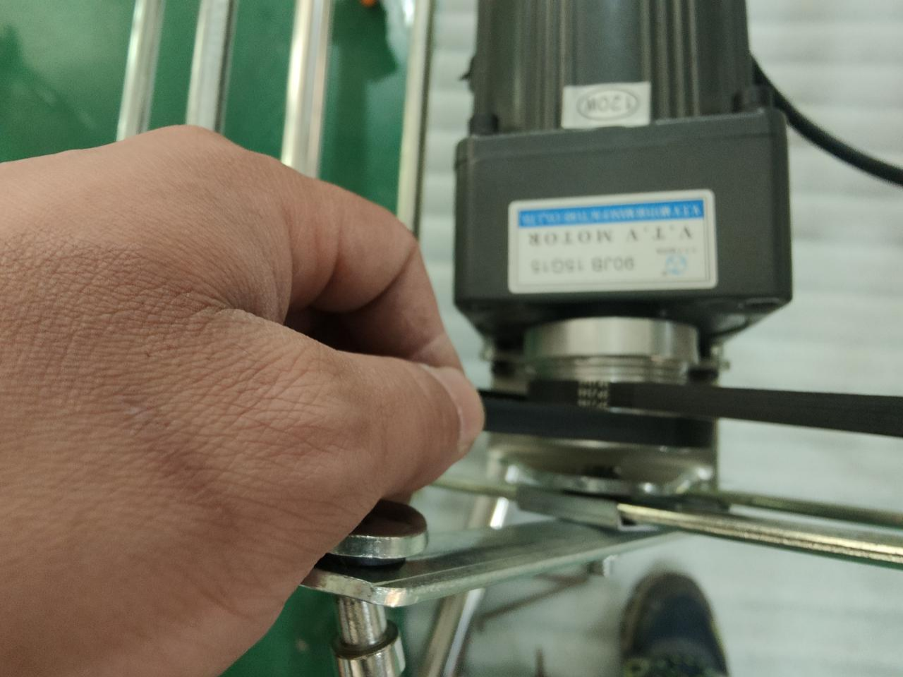 5. Remove belt and reposition motor